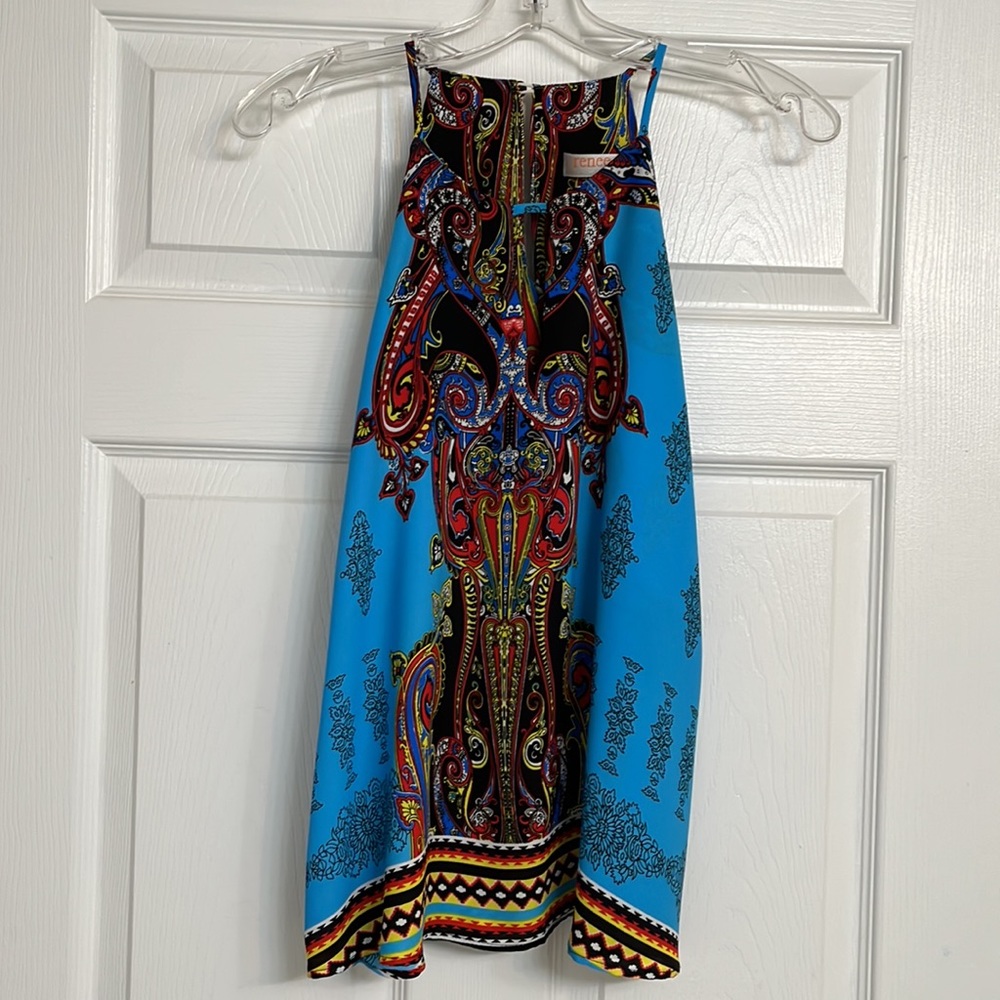 classy, colorful tank. It looks great with Blue jeans and white jeans!